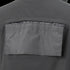 Close-up of the Condor Covert Softshell Jacket in dark gray, featuring a rectangular flap over a vented back section—designed for comfort and functionality, ideal for bushcraft or law enforcement. Now on SALE.