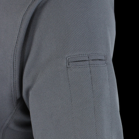 Close-up of the upper sleeve of the Condor Short Sleeve Performance Tactical Polo in gray, displaying its textured fabric and rectangular stitched patch detail.