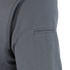 Close-up of the Condor Short Sleeve Performance Tactical Polo in gray, highlighting its textured fabric and a rectangular stitched detail near the shoulder.