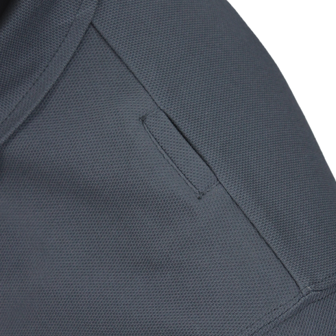 Close-up of the Condor Short Sleeve Performance Tactical Polo in dark gray, highlighting its welt pocket and visible stitching.