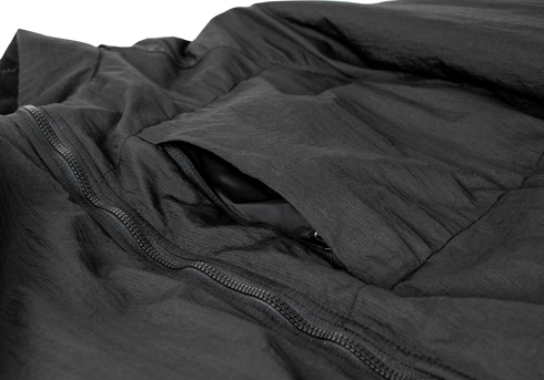 Close-up of the Condor Nimbus Light Loft Jacket in black, featuring a zippered front and a partially open chest pocket with a smooth inner lining.