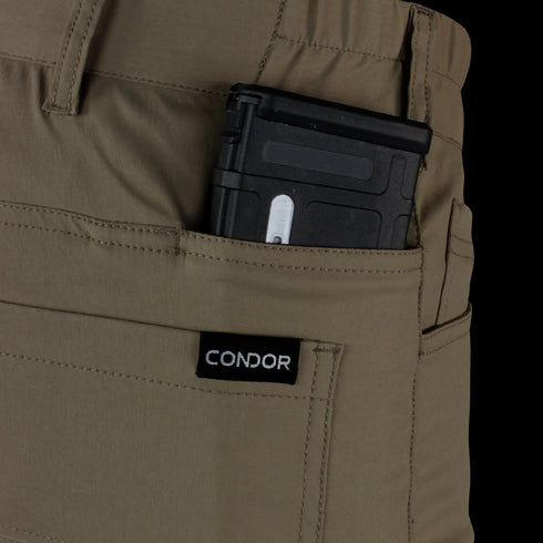 A black magazine is partially visible in the front pocket of tan Condor Cipher Pants—perfect for EDC or law enforcement use.