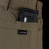 A black magazine is partially visible in the front pocket of tan Condor Cipher Pants—perfect for EDC or law enforcement use.