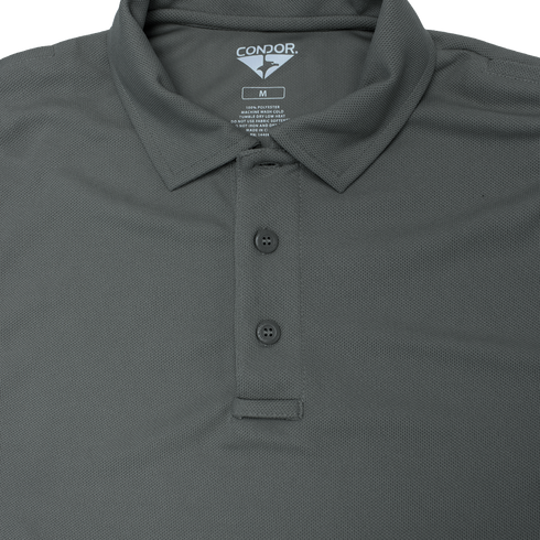 A close-up of a dark gray Condor Long Sleeve Performance Tactical Polo with three buttons, collar, and visible size and care label—perfect apparel for law enforcement or first responders.
