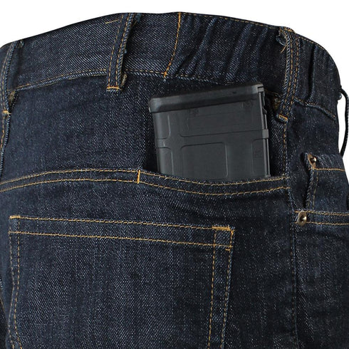 A tactical black magazine is partially visible inside the back pocket of Condor Cipher Jeans.