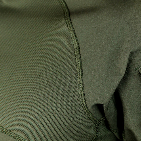 Close-up of Condor Short Sleeve Combat Shirt | SALE: green fabric with visible stitching and texture at the seam where two fabric types meet—ideal for everyday carry or first responder use.