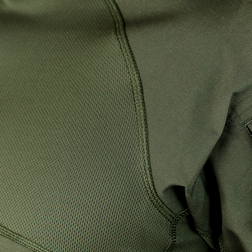 Close-up of Condor Short Sleeve Combat Shirt | SALE: green fabric with visible stitching and texture at the seam where two fabric types meet—ideal for everyday carry or first responder use.
