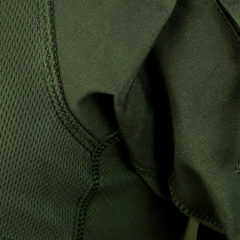 Close-up of green fabric with visible stitching and textured panels on the Condor Short Sleeve Combat Shirt | SALE, designed for tactical use.