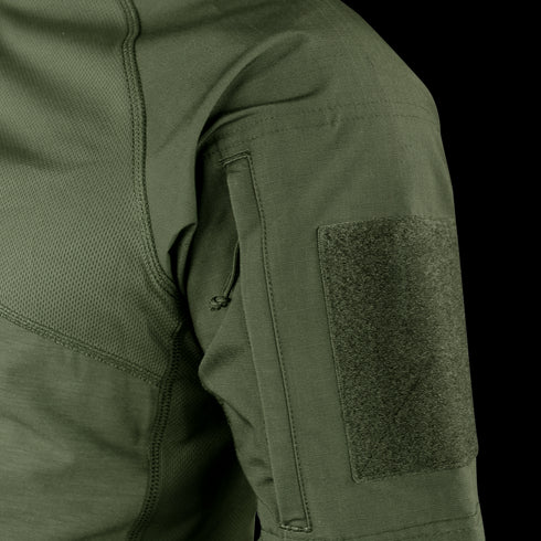 Close-up of Condors Short Sleeve Combat Shirt in green, showing a zippered pocket and large velcro patch panel—perfect for law enforcement or EDC enthusiasts. Now on SALE!.