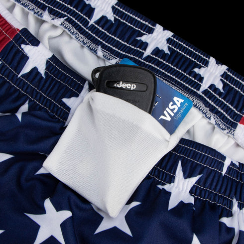 A close-up of a white pocket on Condor Running Shorts, holding a Jeep key fob and a blue Visa Signature credit card—essentials for any tactical or everyday adventure.