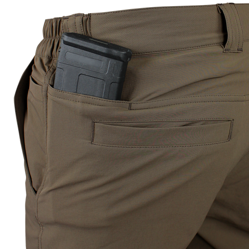 A close-up of Condors Maverick Shorts in brown, featuring a black magazine partially tucked into the back pocket—ideal for EDC enthusiasts.