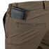 A close-up of Condors Maverick Shorts in brown, featuring a black magazine partially tucked into the back pocket—ideal for EDC enthusiasts.