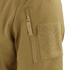 Close-up of the Condor Westpac Softshell Jackets tan sleeve, highlighting a vertical zipper pocket and a large rectangular hook-and-loop patch.