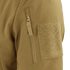 Close-up of the Condor Westpac Softshell Jackets tan sleeve, highlighting a vertical zipper pocket and a large rectangular hook-and-loop patch.