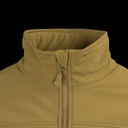 Close-up of the Condor Westpac Softshell Jacket in tan, showing its high collar and partially zipped front with a fabric pull tab on the zipper.