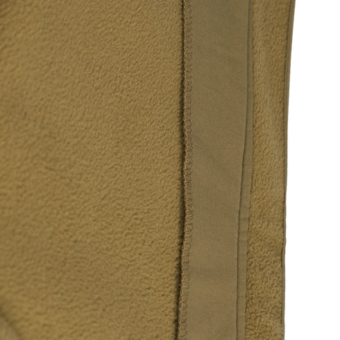 Close-up of the tan fleece fabric and vertical seam on the Condor Westpac Softshell Jacket, commonly used in Military and First Responder apparel.