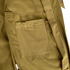 Close-up of the Condor Westpac Softshell Jacket in khaki, showcasing a stitched rectangular pocket and fabric belt loop detail, crafted for Military utility.
