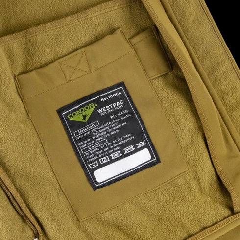 Close-up of a brown Condor Westpac Softshell Jacket, favored in military and tactical circles, featuring an interior label with care instructions and the Condor brand.