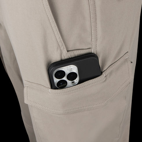 A smartphone with three rear cameras is partially visible in the side pocket of Condor Patrol ADF Pants.