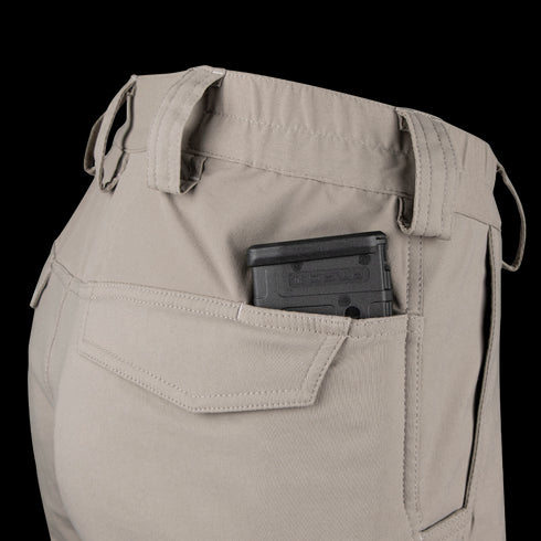A black handgun magazine is partially visible in the back pocket of Condor Patrol ADF Pants in a light color.