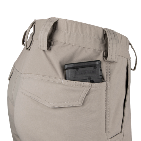 A black handgun magazine is partially visible in the back pocket of Condor Patrol ADF Pants in a light color.