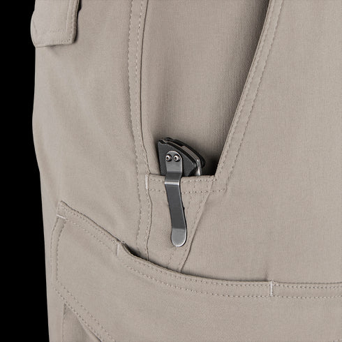 A tactical folding pocket knife with a metal clip is partially visible in the front pocket of Condor Patrol ADF Pants.
