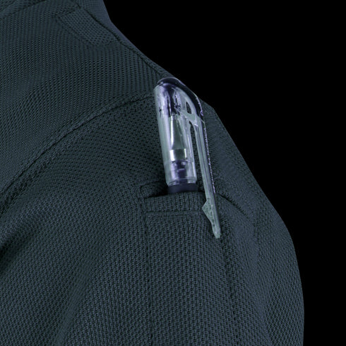 A close-up of a pen clipped into the shoulder pocket of the Condor Womens Short Sleeve Performance Tactical Polo, worn by a first responder.