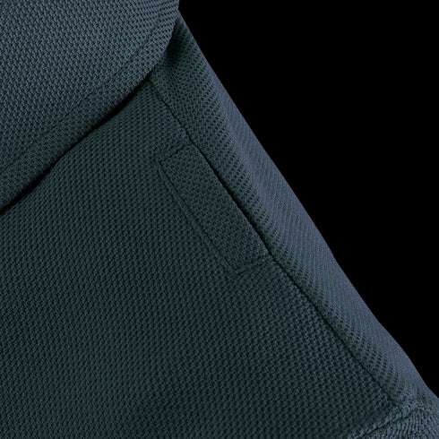 Close-up of a Condor Womens Short Sleeve Performance Tactical Polo shows dark tactical fabric, visible stitching, and a rectangular patch on the surface.