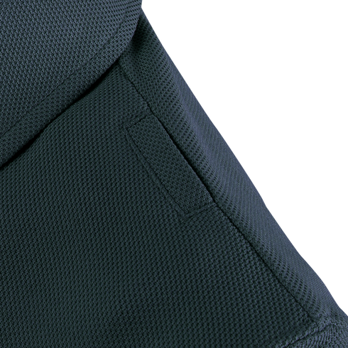 Close-up of a Condor Womens Short Sleeve Performance Tactical Polo shows dark tactical fabric, visible stitching, and a rectangular patch on the surface.