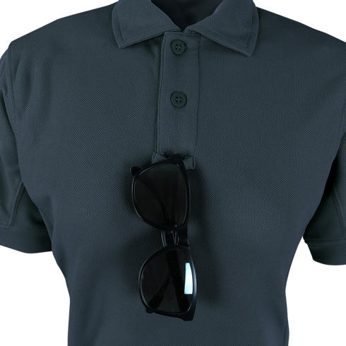 The Condor Women's Short Sleeve Performance Tactical Polo in dark grey features three buttons and has a pair of black sunglasses hanging from the collar.