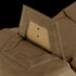 Close-up view of Condor Paladin Tactical Pants in tan, featuring a ballistic plate partially inserted into a pocket with hook-and-loop fasteners.
