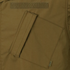 Close-up of the Condor Cadet Class C Uniform Coat, a brown tactical jacket highlighted by a large slanted front pocket with a flap and a small fabric tag.