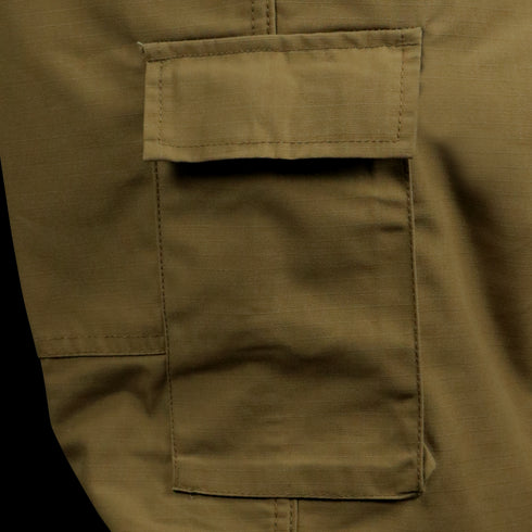 Close-up of a khaki cargo pocket with flap, stitched onto Condor Cadet Class C Uniform Pants—ideal for bushcraft or EDC use.