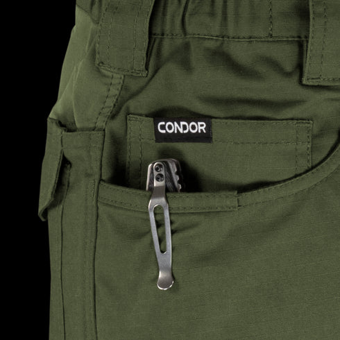 A tactical multitool with a metal pocket clip is partially visible in the front pocket of green Condor Odyssey Pants Gen III.