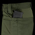 A close-up of Condor Odyssey Pants Gen III in olive green, featuring a black rifle magazine partially visible in the side pocket.