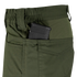 A close-up of Condor Odyssey Pants Gen III in olive green, featuring a black rifle magazine partially visible in the side pocket.