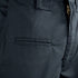 Close-up of Condor Mens Protector EMS Pants, highlighting the zipper, waistband, belt loop, and a horizontal pocket with a grid-patterned fabric.