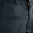 Close-up of Condor Mens Protector EMS Pants, highlighting the zipper, waistband, belt loop, and a horizontal pocket with a grid-patterned fabric.