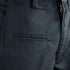 Close-up of Condor Mens Protector EMS Pants, highlighting the zipper, waistband, belt loop, and a horizontal pocket with a grid-patterned fabric.
