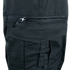 Close-up of a black fabric pocket on the Condor Women's Protector EMS Pants, featuring a horizontal zipper and a flap with a strap below it.