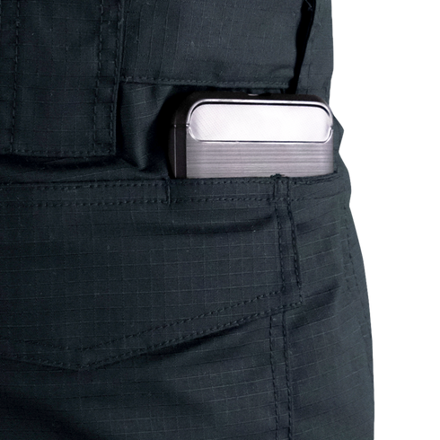 A rectangular metallic device, possibly a phone or power bank, is partially visible in the front pocket of Condor Women's Protector EMS Pants.