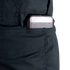 A rectangular metallic device, possibly a phone or power bank, is partially visible in the front pocket of Condor Women's Protector EMS Pants.