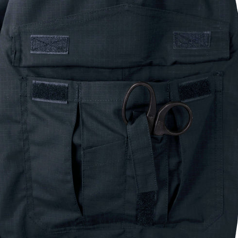 A pair of trauma shears with black handles is partially visible, tucked into the front pocket of Condor Mens Protector EMS Pants.