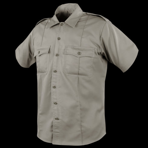The Condor Mens Class B Uniform Shirt is a short-sleeve khaki shirt featuring a button front, two button-flap chest pockets, and shoulder epaulets, ideal for tactical or law enforcement use. Now on SALE. Displayed on a plain background.