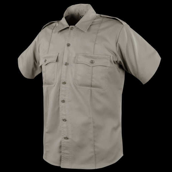 The Condor Mens Class B Uniform Shirt is a short-sleeve khaki shirt featuring a button front, two button-flap chest pockets, and shoulder epaulets, ideal for tactical or law enforcement use. Now on SALE. Displayed on a plain background.