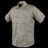 The Condor Mens Class B Uniform Shirt is a short-sleeve khaki shirt featuring a button front, two button-flap chest pockets, and shoulder epaulets, ideal for tactical or law enforcement use. Now on SALE. Displayed on a plain background.