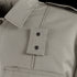 Close-up of the Condor Mens Class B Uniform Shirt in khaki, featuring a pointed collar, shoulder epaulet, chest pocket with visible stitching, and metal snap buttons. Now on SALE.