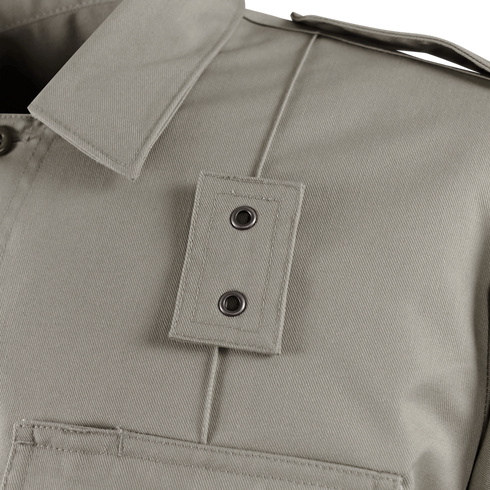 Close-up of the Condor Women's Class B Uniform Shirt in beige, highlighting its pointed collar, shoulder epaulette with two metal snap buttons, and part of a front pocket.