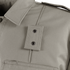 Close-up of the Condor Women's Class B Uniform Shirt in beige, highlighting its pointed collar, shoulder epaulette with two metal snap buttons, and part of a front pocket.