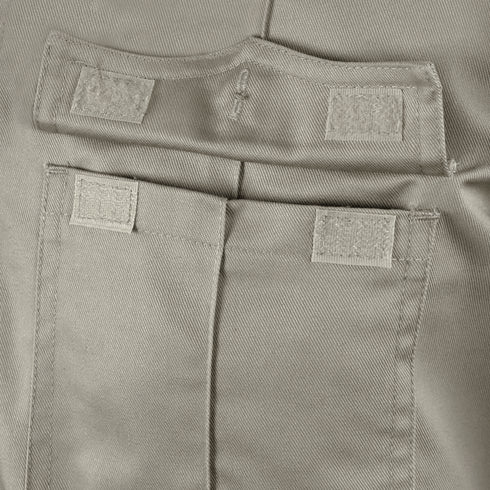 Close-up of the Condor Women's Class B Uniform Shirt in beige, highlighting the fabric pocket with two hook-and-loop fasteners on the flap and one on the pocket body, all securely fastened.